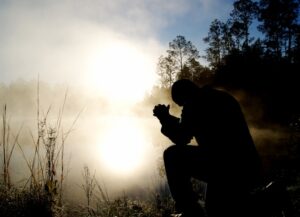 Daily Devotion - Praying with Jesus - Where We Pray - Man praying by a lake