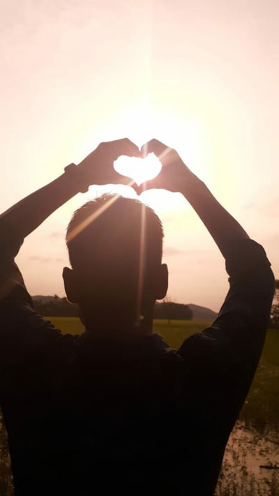 The Other Six - Faith Lutheran Church, Wesley Chapel, FL - Hands making a heart in front of the sun
