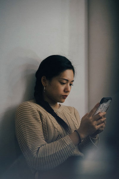 The Other Six - Faith Lutheran Church, Wesley Chapel, FL - Woman looking at her phone