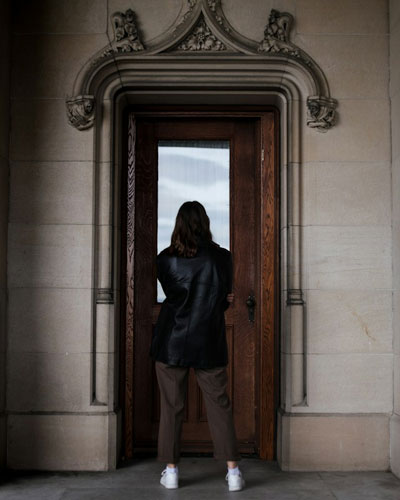 Daily Devotion - Faith Lutheran Church, Wesley Chapel, FL - Woman standing at a door